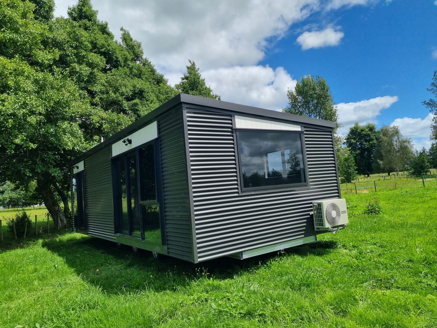 Transportable home, finished exterior with large windows